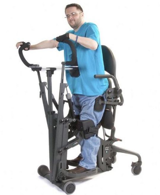 EasyStand Glider in use - shows optional accessories Glide Handle Extensions, No-tray Chest Pad, Hip Supports, and Flat Back Support