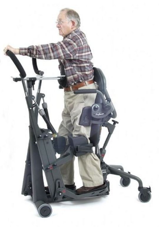 EasyStand Glider in use - shows optional accessories Glide Handle Extensions and Hip Supports