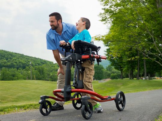 Rifton Pacer Gait Trainers shown with Dynamic Frame and Utility Base with Optional Arm Platforms, Chest Prompt, and Multi-Position Saddle