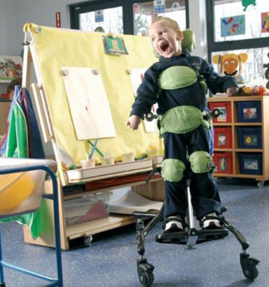 Standing in a standing frame provides a wide range of health benefits for children who cannot stand on their own 