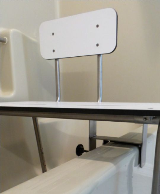 Shown is the clamping mechanism that clamps onto the tub wall.